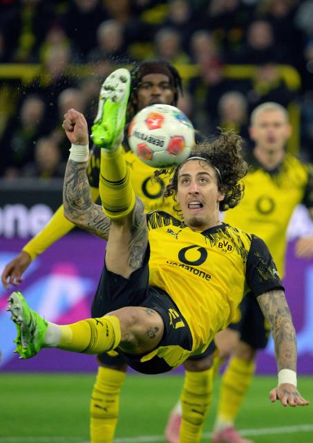 Dortmund's Portuguese forward #21 Fabio Silva (C) plays the ball during the German first division Bundesliga football match between Borussia Dortmund and Werder Bremen in Dortmund, western Germany, on January 13, 2026. (Photo by Sascha Schuermann / AFP) / DFL REGULATIONS PROHIBIT ANY USE OF PHOTOGRAPHS AS IMAGE SEQUENCES AND/OR QUASI-VIDEO  ALTERNATIVE CROP