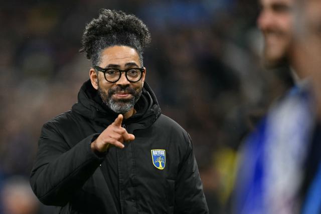 Bayeux's French coach Eric Fouda gestures at the end of the French Cup round of 32 football match between FC Bayeux and Olympique de Marseille (OM) at the Michel-d'Ornano Stadium in Caen on January 13, 2026. (Photo by LOU BENOIST / AFP)