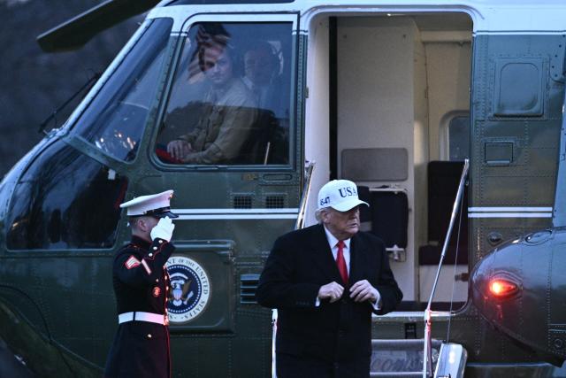 US President Donald Trump steps off Marine One at the White House in Washington, DC, on January 13, 2026. Trump traveled to Detroit, Michigan, to speak to the Detroit Economic Club and visit a Ford production plant. (Photo by Brendan SMIALOWSKI / AFP)