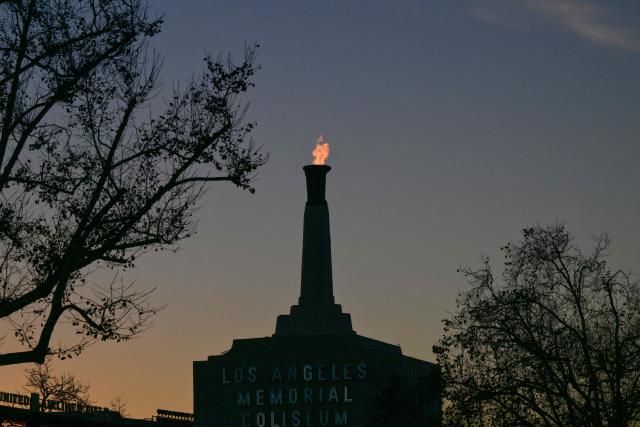 The LA28 Olympic cauldron is lit after a ceremonial lighting at the Memorial Coliseum in Los Angeles on January 13, 2026, ahead of the launch of ticket registration for the 2028 Summer Olympic Games. (Photo by Frederic J. Brown / AFP)