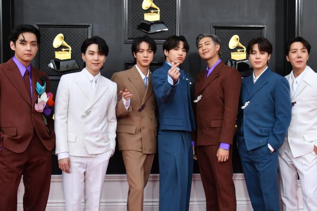 (FILES) South Korean boy band BTS arrives for the 64th Annual Grammy Awards at the MGM Grand Garden Arena in Las Vegas on April 3, 2022. K-pop megastars BTS will kick off their first world tour in four years in April 2026, their label said on January 14, 2026, part of a hotly-anticipated comeback following a hiatus for the South Koreans whose music has become a global phenomenon. (Photo by ANGELA  WEISS / AFP)
