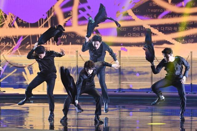 (FILES) South Korean boy band BTS performs onstage during the 64th Annual Grammy Awards at the MGM Grand Garden Arena in Las Vegas on April 3, 2022. K-pop megastars BTS will kick off their first world tour in four years in April 2026, their label said on January 14, 2026, part of a hotly-anticipated comeback following a hiatus for the South Koreans whose music has become a global phenomenon. (Photo by VALERIE MACON / AFP)