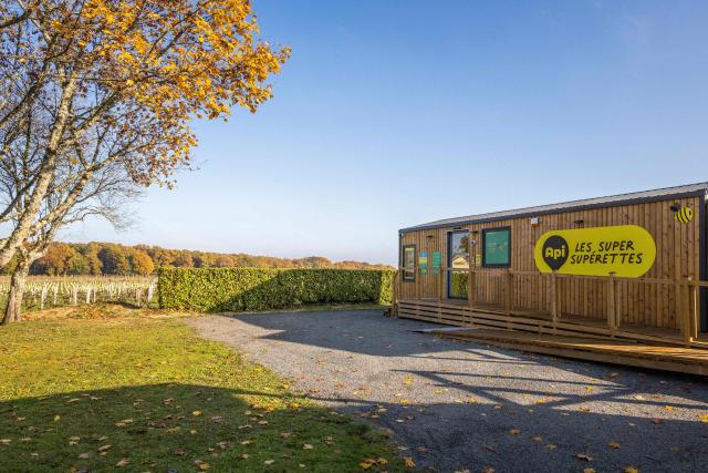 (FILES) A photograph taken in Claix, western France, on December 1, 2022 shows the API self-service supermarket set up in a 40m2 wooden mobile home. The Api company, which plans to install 40 new self-service convenience stores in the region by 2023, was founded two years ago by Julien Nau and Alex Grammatico who are local residents and who discovered a similar concept in Sweden. (Photo by YOHAN BONNET / AFP)