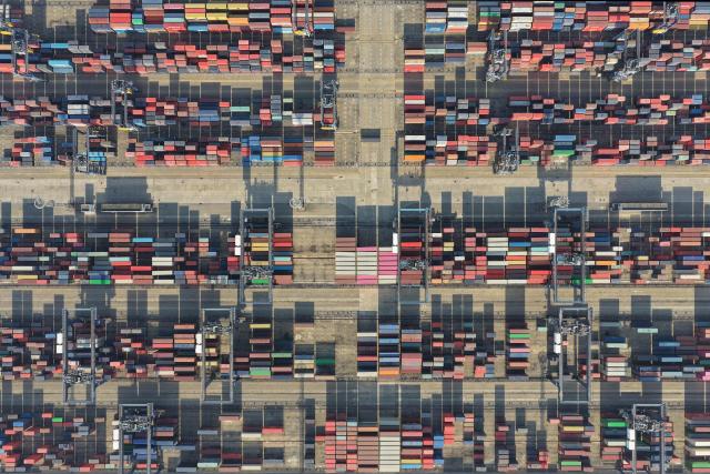 This aerial photo shows containers at the Longtan port in Nanjing, eastern China's Jiangsu province on January 14, 2026. China said January 14, 2026 trade volumes reached a record in 2025, as global demand for Chinese goods held firm despite a slump in exports to the US after Donald Trump raised tariffs. (Photo by AFP) / China OUT