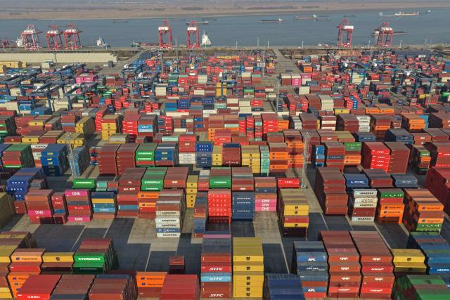 This aerial photo shows containers at the Longtan port in Nanjing, eastern China's Jiangsu province on January 14, 2026. China said January 14, 2026 trade volumes reached a record in 2025, as global demand for Chinese goods held firm despite a slump in exports to the US after Donald Trump raised tariffs. (Photo by AFP) / China OUT