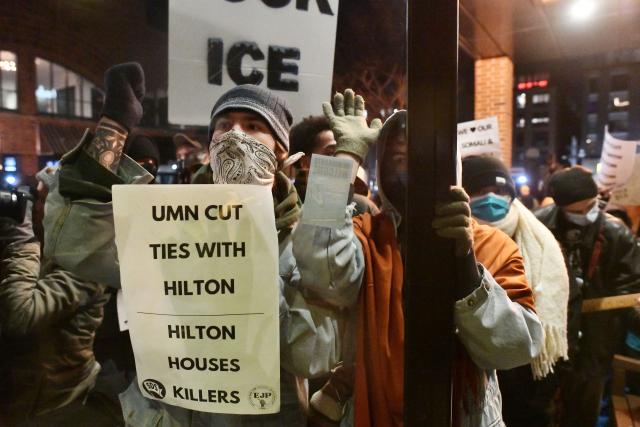 Anti-ICE demonstrators protest outside the Graduate Hotel where federal immigration agents are believed to be staying in Minneapolis, Minnesota on January 13, 2026. Hundreds more federal agents were heading to Minneapolis, the US homeland security chief said on January 11, brushing aside demands by the Midwestern city's Democratic leaders to leave after an immigration officer fatally shot a woman protester. In multiple TV interviews, US Homeland Secretary Kristi Noem defended the actions of the officer who shot and killed 37-year-old Renee Nicole Good, whose death has sparked renewed protests nationwide against President Donald Trump's immigration crackdown. (Photo by Octavio JONES / AFP)