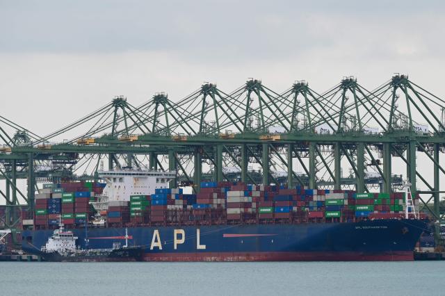 A container vessel is docked at Pasir Panjang terminal port in Singapore on January 14, 2026. (Photo by Roslan RAHMAN / AFP)