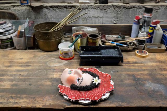 A mask of a member of the yodel group 'Spitzli Schueppel' is seen during the traditional 'Silvesterchlausen' (Saint Sylvester’s Day festivities) in Urnasch, eastern Switzerland, on January 13, 2026. Silvesterchlausen a traditional custom from the Swiss canton of Appenzell, features colorfully dressed figures organized in groups called 'Schuppel' who symbolically chase away the old year and welcome the new one by traveling from farmstead to farmstead to sing yodels and greet farmers. The tradition take place twice a year: on December 31 for the “New Silvester,” and again on January 13, following the old Julian calendar. (Photo by ENNIO LEANZA / AFP)