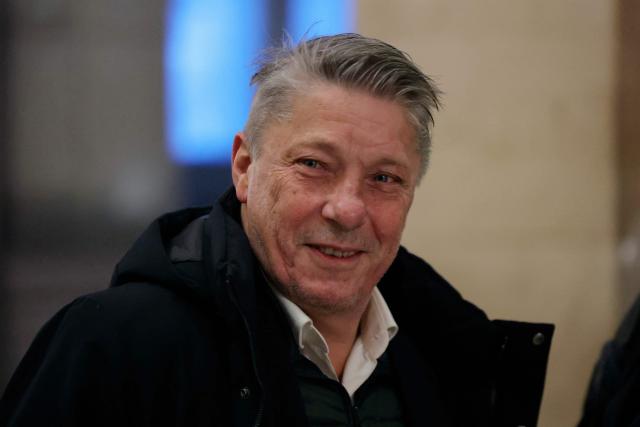 French Certified Public Accountant Nicolas Crochet arrives for a hearing in his appeal trial on suspicion of embezzlement of European public funds, at Paris courthouse, on January 14, 2026. The appeal comes after a court last year barred the President of the RN parliamentary group Marine Le Pen from running for office for five years over a European Parliament fake-jobs scam involving her and other officials from her National Rally party. The hearing is expected to run until February 11, 2026, with a decision expected this summer. Twelve of the accused, as well as the far-right party itself, have appealed against the verdict while another 12 people -- including one of Le Pen's sisters -- have decided to accept their convictions without appealing. (Photo by Thomas SAMSON / AFP)