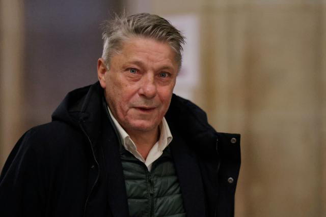 French Certified Public Accountant Nicolas Crochet arrives for a hearing in his appeal trial on suspicion of embezzlement of European public funds, at Paris courthouse, on January 14, 2026. The appeal comes after a court last year barred the President of the RN parliamentary group Marine Le Pen from running for office for five years over a European Parliament fake-jobs scam involving her and other officials from her National Rally party. The hearing is expected to run until February 11, 2026, with a decision expected this summer. Twelve of the accused, as well as the far-right party itself, have appealed against the verdict while another 12 people -- including one of Le Pen's sisters -- have decided to accept their convictions without appealing. (Photo by Thomas SAMSON / AFP)