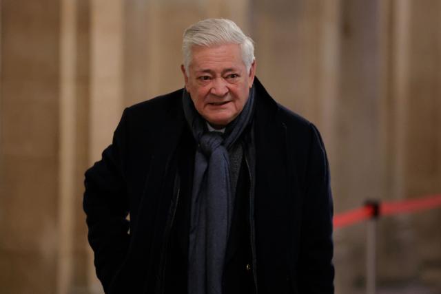 Former member of the European Parliament Bruno Gollnisch arrives for a hearing in his appeal trial on suspicion of embezzlement of European public funds, at Paris courthouse, on January 14, 2026. The appeal comes after a court last year barred the President of the RN parliamentary group Marine Le Pen from running for office for five years over a European Parliament fake-jobs scam involving her and other officials from her National Rally party. The hearing is expected to run until February 11, 2026, with a decision expected this summer. Twelve of the accused, as well as the far-right party itself, have appealed against the verdict while another 12 people -- including one of Le Pen's sisters -- have decided to accept their convictions without appealing. (Photo by Thomas SAMSON / AFP)
