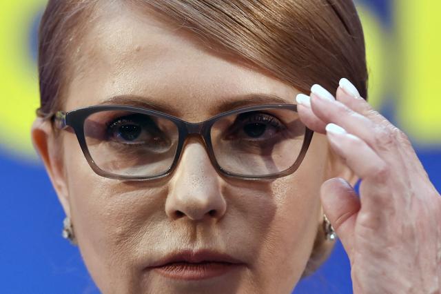 (FILES) Former Ukrainian Prime Minister and presidential candidate Yulia Tymoshenko adjusts her glasses as she prepares to deliver a speech at her campaign headquarters in Kiev, after the first round of Ukraine's presidential election on March 31, 2019. Yulia Tymoshenko, a former Ukrainian prime minister, confirmed that her party's offices had been raided during the night as part of a corruption investigation. (Photo by Sergei GAPON / AFP)