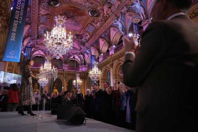 Paris' Mayor Anne Hidalgo reacts as attendees applaud her after her speech for the 2026 whishes at Paris City Hall, in central Paris on January 14, 2026. (Photo by Thomas SAMSON / AFP)