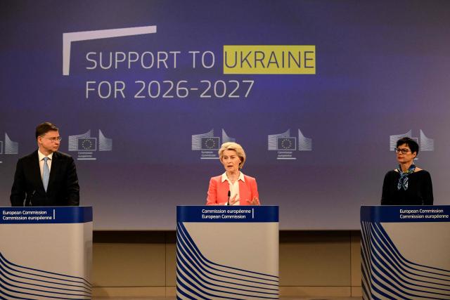 EU Commissioner for Economy and Productivity, Implementation and Simplification Valdis Dombrovskis (L), European Commission President Ursula von der Leyen (C), and EU Commissioner for Enlargement Marta Kos (R) give a press conference to present a financial support package for Ukraine for 2026–2027 at the Eu headquarters in Brussels on January 14, 2026. (Photo by Nicolas TUCAT / AFP)