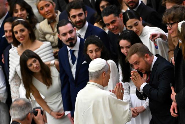 Pope Leo XIV blesses newlyweds during his weekly general audience at Paul VI Hall in the Vatican on January 14, 2026. (Photo by Andreas SOLARO / AFP)