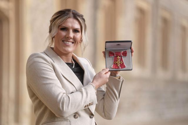 Chelsea's English defender Millie Bright poses with their medal after being appointed an Officer of the Order of the British Empire (OBE) at an investiture ceremony at Windsor Castle, in Windsor on January 14, 2026. (Photo by Andrew Matthews / POOL / AFP)