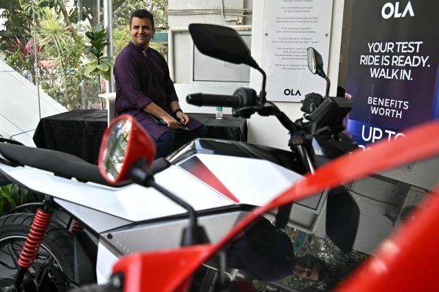Indian entrepreneur Bhavish Aggarwal, co-founder and CEO of Ola, looks on during the rollout of the company’s 4680 Bharat Cell products at an Ola Electric store in Bengaluru on January 14, 2026. (Photo by Idrees MOHAMMED / AFP)