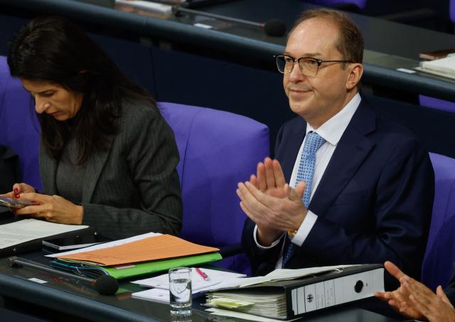 German Interior Minister Alexander Dobrindt and German Minister for Economic Cooperation and Development Reem Alabali-Radovan sit in the plenary for a question time at the Bundestag (lower house of parliament) in Berlin, on January 14, 2026. (Photo by Odd ANDERSEN / AFP)