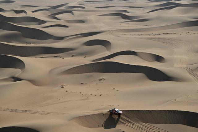TOPSHOT - Toyota Gazoo Racing W2rc’s South African driver Henk Lategan and South African co-pilot Brett Cummings compete in Stage 10 of the 48th edition of the Dakar Rally 2026, between Bisha and Bisha, Saudi Arabia, on January 14, 2026. (Photo by Giuseppe CACACE / AFP)
