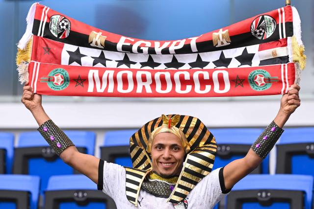 An Egypt supporter cheers during the Africa Cup of Nations (CAN) semi-final football match between Senegal and Egypt at the Grand stadium in Tangiers on January 14, 2026. (Photo by SEBASTIEN BOZON / AFP)
