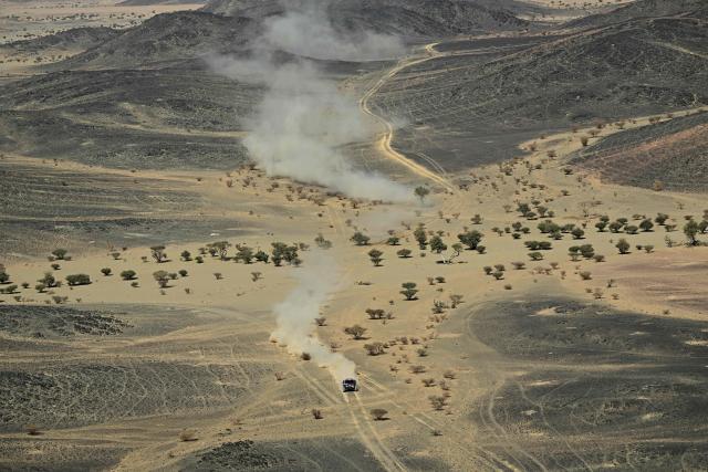 The Dacia Sandriders’s Qatari driver Nasser Al-Attiyah and Belgian co-pilot Fabian Lurquin compete in Stage 10 of the 48th edition of the Dakar Rally 2026, between Bisha and Bisha, Saudi Arabia, on January 14, 2026. (Photo by Giuseppe CACACE / AFP)