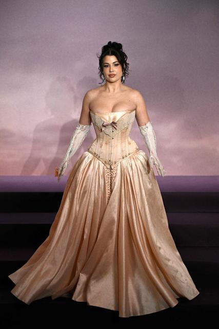 French content creator Marie (Enjoyphoenix) arrives for the World premiere of "Bridgerton Season 4" at the Palais Brongniart in Paris on January 14, 2026. (Photo by JULIEN DE ROSA / AFP)