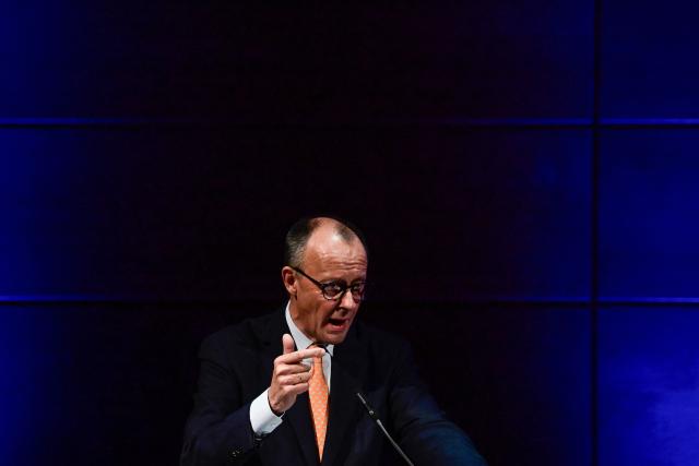 German Chancellor Friedrich Merz addresses the New Year’s reception of Halle's Chamber of Commerce and Industry in Halle,eastern Germany on January 14, 2026. (Photo by John MACDOUGALL / AFP)