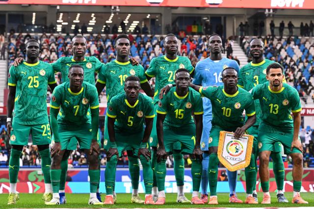 Senegal's players pose for a team picture prior the Africa Cup of Nations (CAN) semi-final football match between Senegal and Egypt at the Grand stadium in Tangiers on January 14, 2026. (Photo by SEBASTIEN BOZON / AFP)