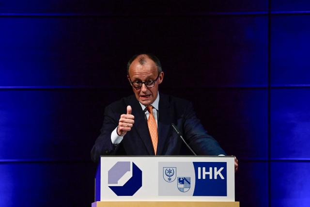 German Chancellor Friedrich Merz addresses the New Year’s reception of Halle's Chamber of Commerce and Industry in Halle,eastern Germany on January 14, 2026. (Photo by John MACDOUGALL / AFP)