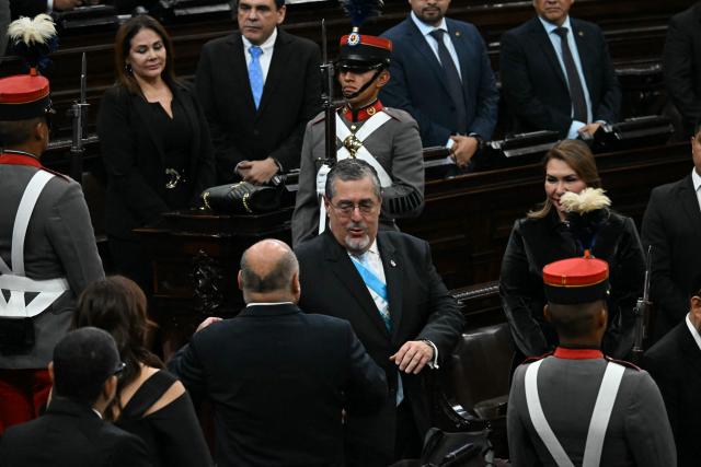 Guatemala's President Bernardo Arevalo (C) arrives to deliver his official report of his second year as head of state at the National Congress in Guatemala City on January 14, 2026. (Photo by JOHAN ORDONEZ / AFP)