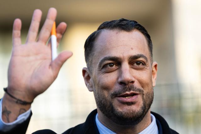 French leftist party La France Insoumise (LFI) member of Parliament and mayoral candidate for the 2026 municipal elections of Marseille Sebastien Delogu waves after taking part in a "Toxic Tour", a day of action called by LFI to bring awareness on pollution and risks linked to disaffected industrial sites, in Marseille on January 14, 2026. (Photo by MIGUEL MEDINA / AFP)