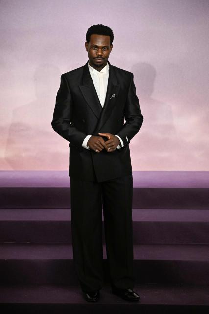 British actor Victor Alli arrives for the World premiere of "Bridgerton Season 4" at the Palais Brongniart in Paris on January 14, 2026. (Photo by JULIEN DE ROSA / AFP)
