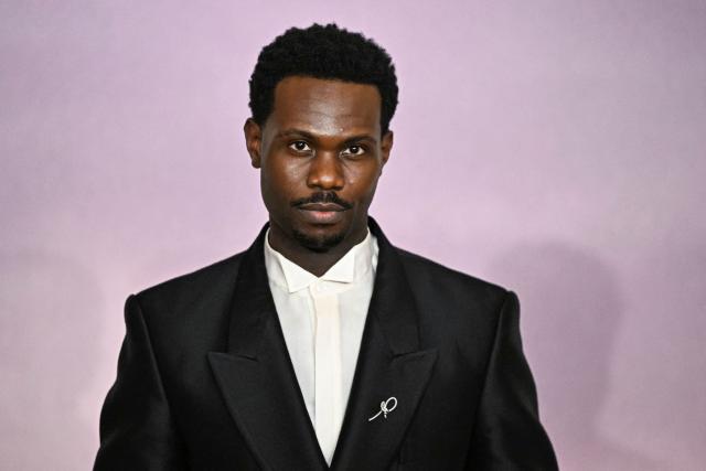 British actor Victor Alli arrives for the World premiere of "Bridgerton Season 4" at the Palais Brongniart in Paris on January 14, 2026. (Photo by JULIEN DE ROSA / AFP)