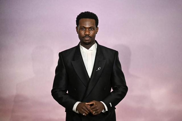 British actor Victor Alli arrives for the World premiere of "Bridgerton Season 4" at the Palais Brongniart in Paris on January 14, 2026. (Photo by JULIEN DE ROSA / AFP)
