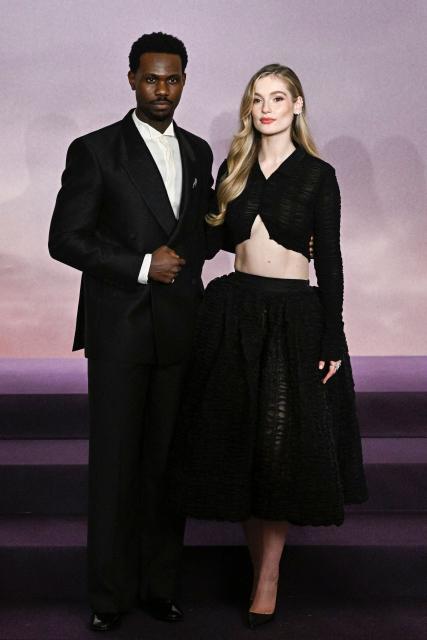 British actor Victor Alli and British actress Hannah Dodd arrive for the World premiere of "Bridgerton Season 4" at the Palais Brongniart in Paris on January 14, 2026. (Photo by JULIEN DE ROSA / AFP)