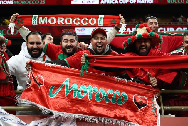 Morocco's supporters cheer before the Africa Cup of Nations (CAN) semi-final football match between Nigeria and Morocco at the Prince Moulay Abdellah stadium in Rabat on January 14, 2026. (Photo by Franck FIFE / AFP)