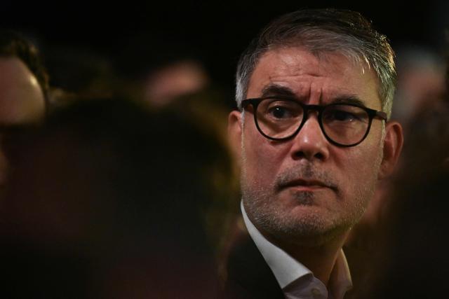 First Secretary of the Socialist Party and Socialistes et Apparentes' MP Olivier Faure attends a meeting of the united left at La Bellevilloise in Paris on January 14, 2026. Socialistes et Apparentes' MP Emmanuel Gregoire, candidate for the united left, outside La France Insoumise party, in the municipal elections to be held on March 15 and 22, 2026, holds his first campaign rally. (Photo by Martin LELIEVRE / AFP)