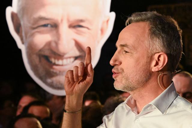 Socialistes et Apparentes' MP and candidate for mayor in Paris Emmanuel Gregoire gestures as he delivers a speech during a meeting of the united left at La Bellevilloise in Paris on January 14, 2026. Socialistes et Apparentes' MP Emmanuel Gregoire, candidate for the united left, outside La France Insoumise party, in the municipal elections to be held on March 15 and 22, 2026, holds his first campaign rally. (Photo by Martin LELIEVRE / AFP)