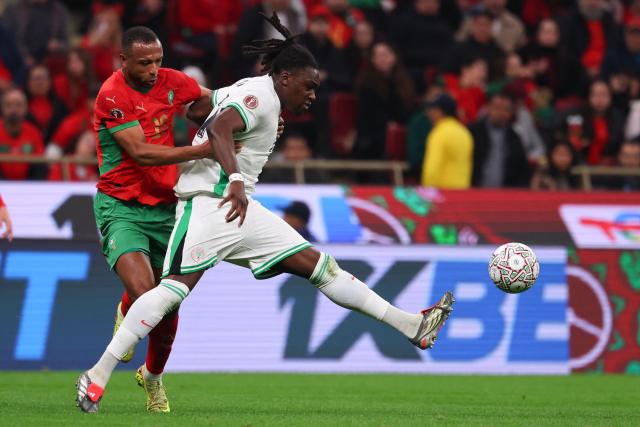 Morocco's forward #20 Ayoub El Kaabi (L) and Nigeria's defender #21 Calvin Bassey fights for the ball during the Africa Cup of Nations (CAN) semi-final football match between Nigeria and Morocco at the Prince Moulay Abdellah stadium in Rabat on January 14, 2026. (Photo by FRANCK FIFE / AFP)
