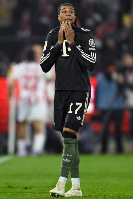 Bayern Munich's French midfielder #17 Michael Olise reacts during the German first division Bundesliga football match between FC Cologne and FC Bayern Munich in Cologne, western Germany on January 14, 2026. (Photo by INA FASSBENDER / AFP) / DFL REGULATIONS PROHIBIT ANY USE OF PHOTOGRAPHS AS IMAGE SEQUENCES AND/OR QUASI-VIDEO