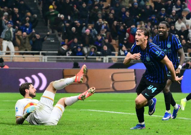 Inter Milan's Italian forward #94 Pio Esposito (R) celebrates after scoring Inter's first goal during the Italian Serie A football match between Inter Milan and Lecce at the San Siro stadium in Milan, on January 14, 2026. (Photo by Stefano RELLANDINI / AFP)
