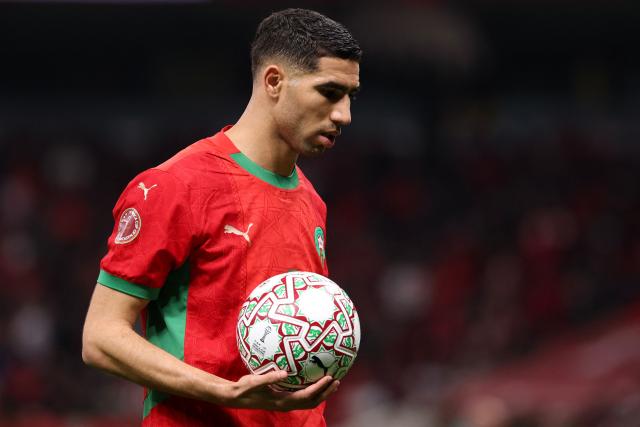 Morocco's defender #02 Achraf Hakimi holds the ball during the Africa Cup of Nations (CAN) semi-final football match between Nigeria and Morocco at the Prince Moulay Abdellah stadium in Rabat on January 14, 2026. (Photo by FRANCK FIFE / AFP)