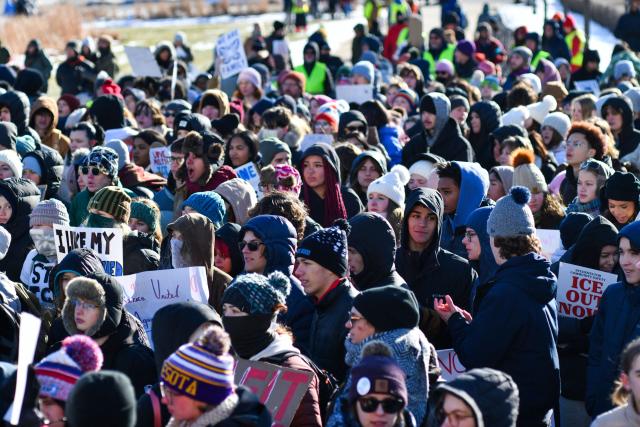 High school students protest against ICE outside the State Capitol in St. Paul, Minnesota, on January 14, 2026. Hundreds more federal agents were heading to Minneapolis, the US homeland security chief said on January 11, brushing aside demands by the Midwestern city's Democratic leaders to leave after an immigration officer fatally shot a woman protester. In multiple TV interviews, US Homeland Secretary Kristi Noem defended the actions of the officer who shot and killed 37-year-old Renee Nicole Good, whose death has sparked renewed protests nationwide against President Donald Trump's immigration crackdown. (Photo by Octavio JONES / AFP)