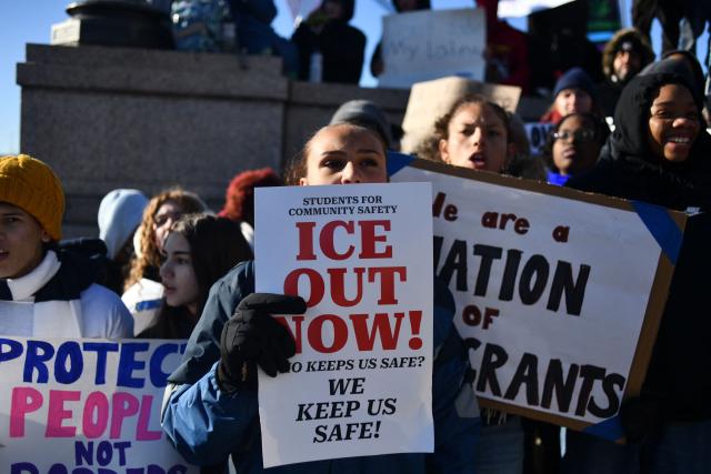 High school students gather for anti-ICE protest outside the State Capitol in St. Paul, Minnesota, to call for an end to federal immigration detentions and enforcement actions, days after 37-year-old Renee Nicole Good was shot and killed by a US Immigration and Customs Enforcement (ICE) agent, on January 14, 2026. Hundreds more federal agents were heading to Minneapolis, the US homeland security chief said on January 11, brushing aside demands by the Midwestern city's Democratic leaders to leave after an immigration officer fatally shot a woman protester. In multiple TV interviews, US Homeland Secretary Kristi Noem defended the actions of the officer who shot and killed 37-year-old Renee Nicole Good, whose death has sparked renewed protests nationwide against President Donald Trump's immigration crackdown. (Photo by Octavio JONES / AFP)