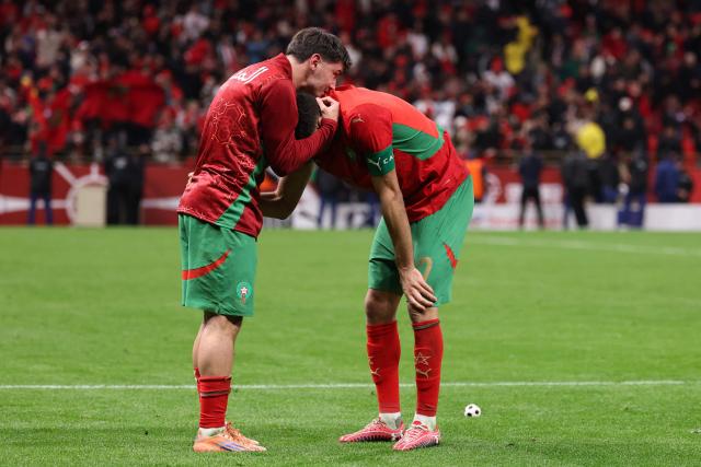 Morocco's defender #02 Achraf Hakimi and Morocco's forward #10 Brahim Diaz celebrate after winning the Africa Cup of Nations (CAN) semi-final football match between Nigeria and Morocco at the Prince Moulay Abdellah stadium in Rabat on January 14, 2026. (Photo by FRANCK FIFE / AFP)