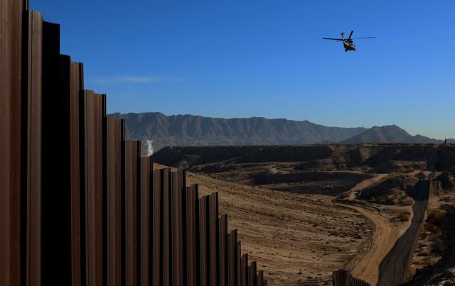 An US Air and Marine Operations (AMO) helicopter patrols the US-Mexico border at Santa Teresa, New Mexico, US, as seen from Ciudad Juarez, Chihuahua state, Mexico on January 14, 2026. (Photo by Herika Martinez / AFP)