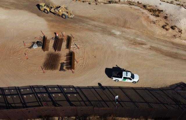 Aerial view of an US Border Patrol pickup bext to the wall being constructed at the US-Mexico border in Santa Teresa, New Mexico, US, as seen from Ciudad Juarez, Chihuahua state, Mexico on January 14, 2026. (Photo by Herika Martinez / AFP)