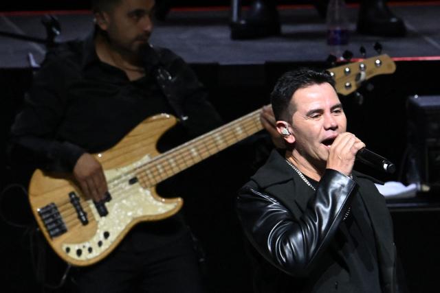 Colombian singer Jhonny Rivera performs during the symbolic funeral honors for Colombian singer Yeison Jimenez in Bogota on January 14, 2026. Six people died on january 10, including popular singer Yeison Jimenez, when the small plane they were traveling in crashed shortly after takeoff in central Colombia, authorities said. (Photo by Raul ARBOLEDA / AFP)