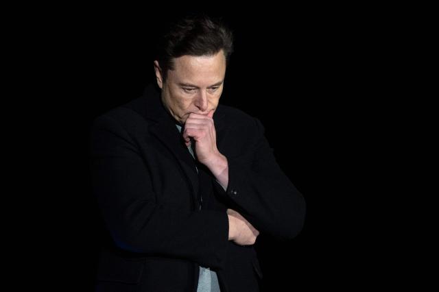 (FILES) Elon Musk pauses and looks down as he speaks during a press conference at SpaceX's Starbase facility near Boca Chica Village in South Texas on February 10, 2022. Elon Musk's platform X on January 14, 2026 announced measures to prevent its AI chatbot Grok from undressing images of real people, following global backlash over its generation of sexualized images of women and children. (Photo by JIM WATSON / AFP)