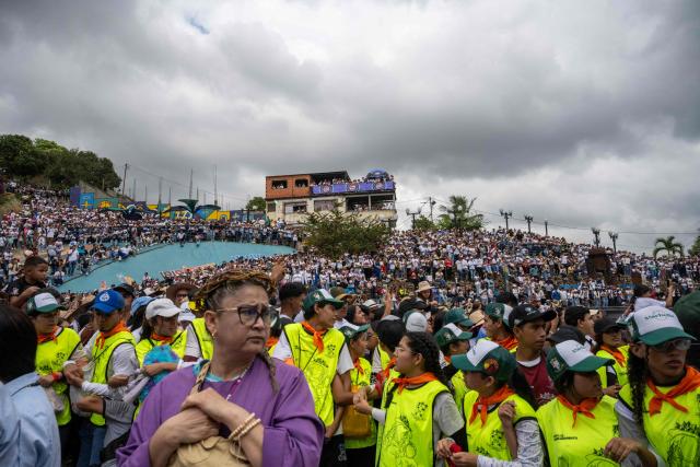 Faithfuls attend the annual procession of Divina Pastora in Barquisimeto, Venezuela on January 14, 2026. (Photo by Maryorin Mendez / AFP)